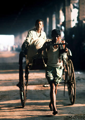 Photo of rickshaw driver in Calcutta, India by Ron Veto style=