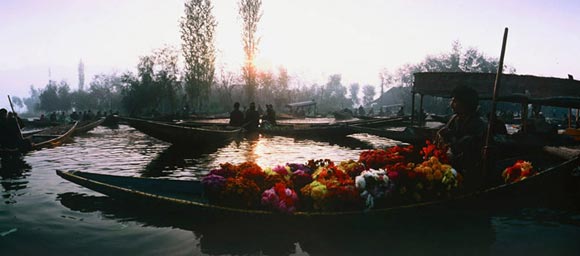 Photo of floating market at sunrise in Dal Lake, Kashmir by Ron Veto /></div>

<p style=