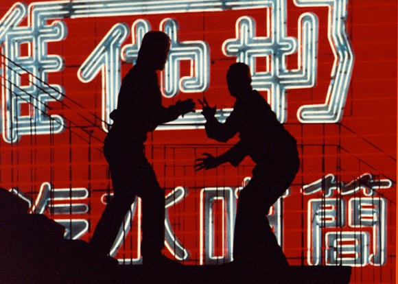 Silhouette photo of two men fighting at Hong Kong Island by Ron Veto /></div>
<p style=